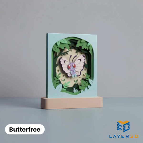 Butterfree layered 3D printed shadowbox on a display base, hand-finished desk decor by Layer3D