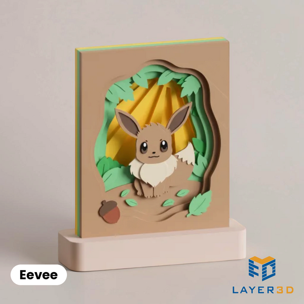 Eevee layered 3D printed shadowbox on a display base, hand-finished desk decor by Layer3D