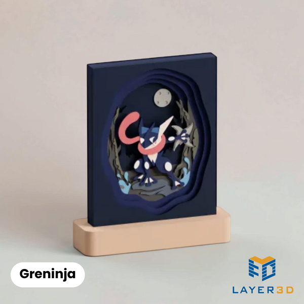 Greninja layered 3D printed shadowbox on a display base, hand-finished desk decor by Layer3D