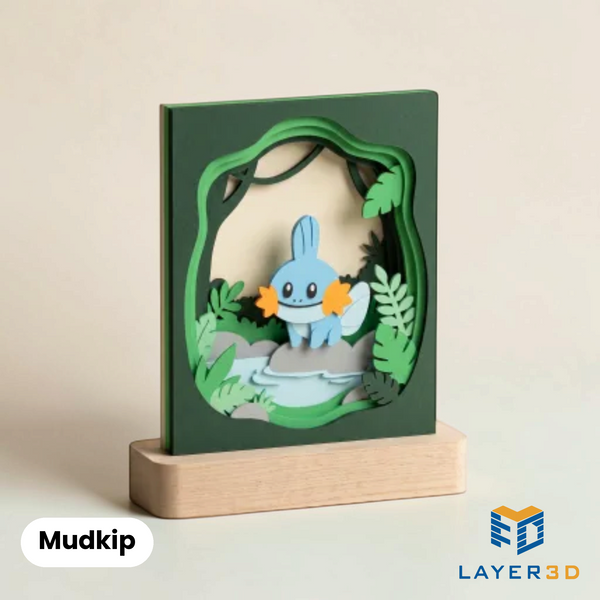 Mudkip layered 3D printed shadowbox on a display base, hand-finished desk decor by Layer3D