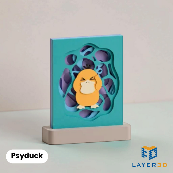 Psyduck layered 3D printed shadowbox on a display base, hand-finished desk decor by Layer3D