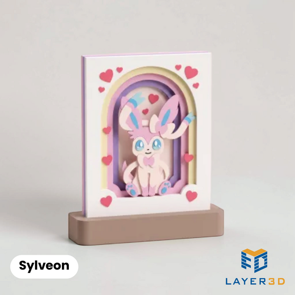 Sylveon layered 3D printed shadowbox on a display base, hand-finished desk decor by Layer3D