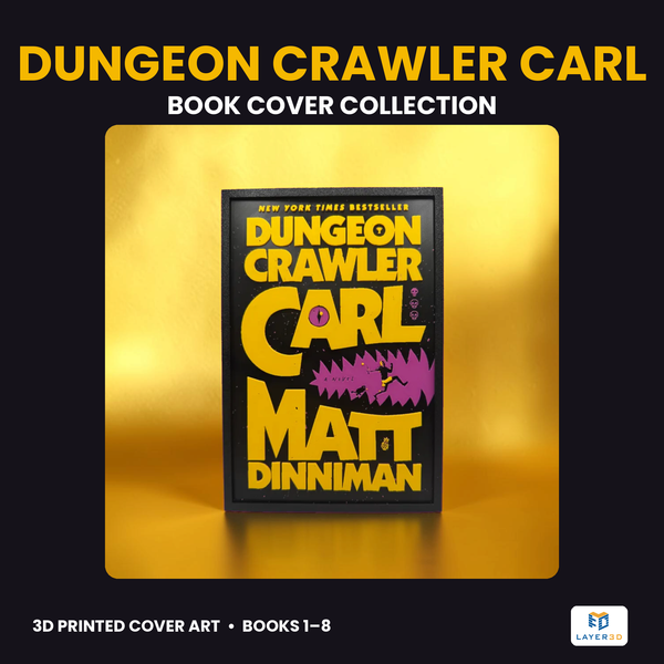 Framed 3D printed book cover wall art in yellow and purple on black against a gold backdrop